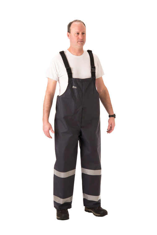 NASCO PetroStorm FR rain bib overalls with reflective trim in Navy, worn view