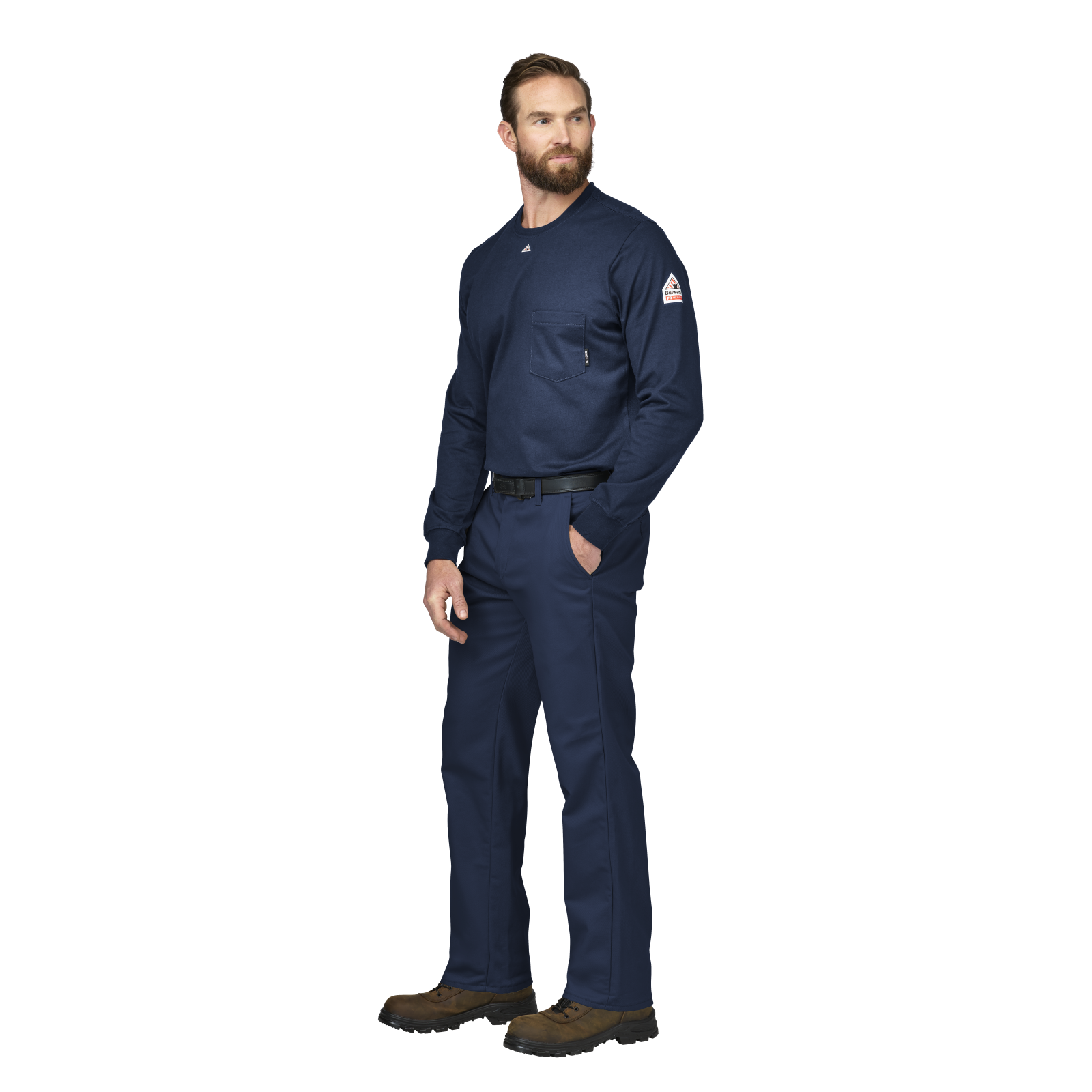 Man wearing a Bulwark FR navy blue work uniform with a logo on a white background