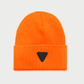 Vohl Hi Vis Beanie in Safety Orange, front view with black triangular logo patch on folded cuff - SKU AC-BN-200-OS | color:Safety Orange