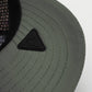 Close-up of the green Vohl Cap underside brim with stitched detailing and black Vohl logo patch - SKU AC-CV-400-OS | color:Green