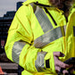 Close-up of hi-vis yellow insulated waterproof jacket with reflective detailing and zip pocket – SKU HV-IJ-105 | color:Safety Yellow
