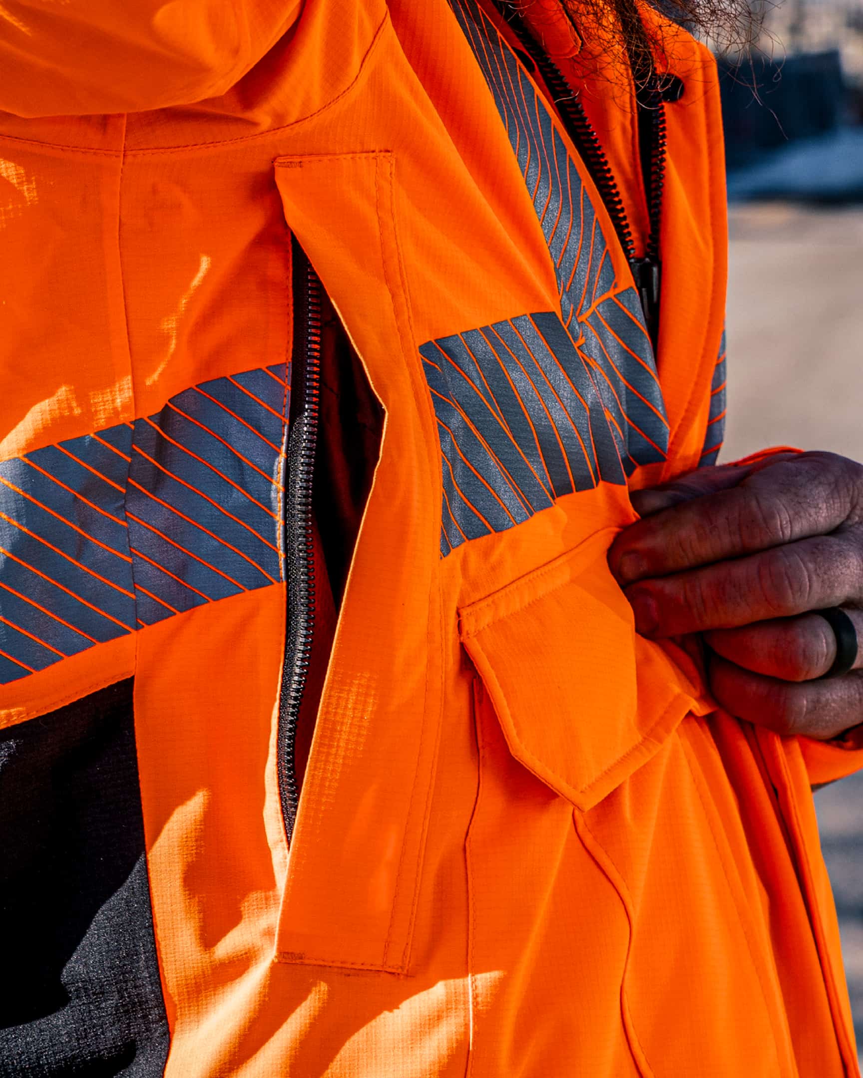 Vohl Hi Vis Waterproof Insulated Jacket – Safety Orange – SKU HV-IJ-205, lifestyle closeup | color:Safety Orange