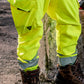 Close-up of hi-vis yellow jogger work pants with cargo pocket, reinforced knees, and reflective cuffs worn with work boots – SKU HV-JG-105 | color:Safety Yellow