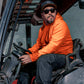 Man wearing hi-vis orange long sleeve sun hoody seated in machinery cab – SKU HV-SH-200 | color:Safety Orange