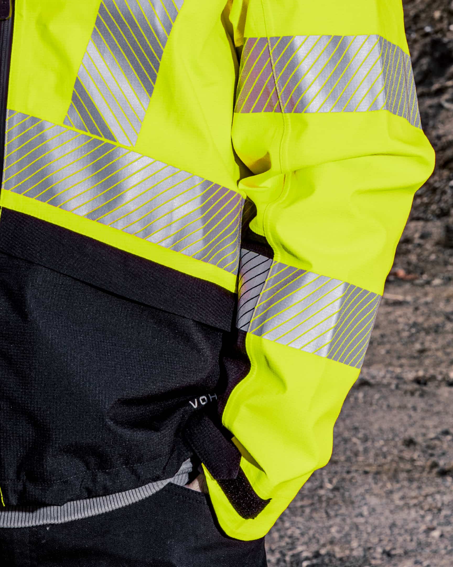Close-up of hi-vis yellow waterproof shell jacket with reflective tape and sleeve detail – SKU HV-SJ-105 | color:Safety Yellow