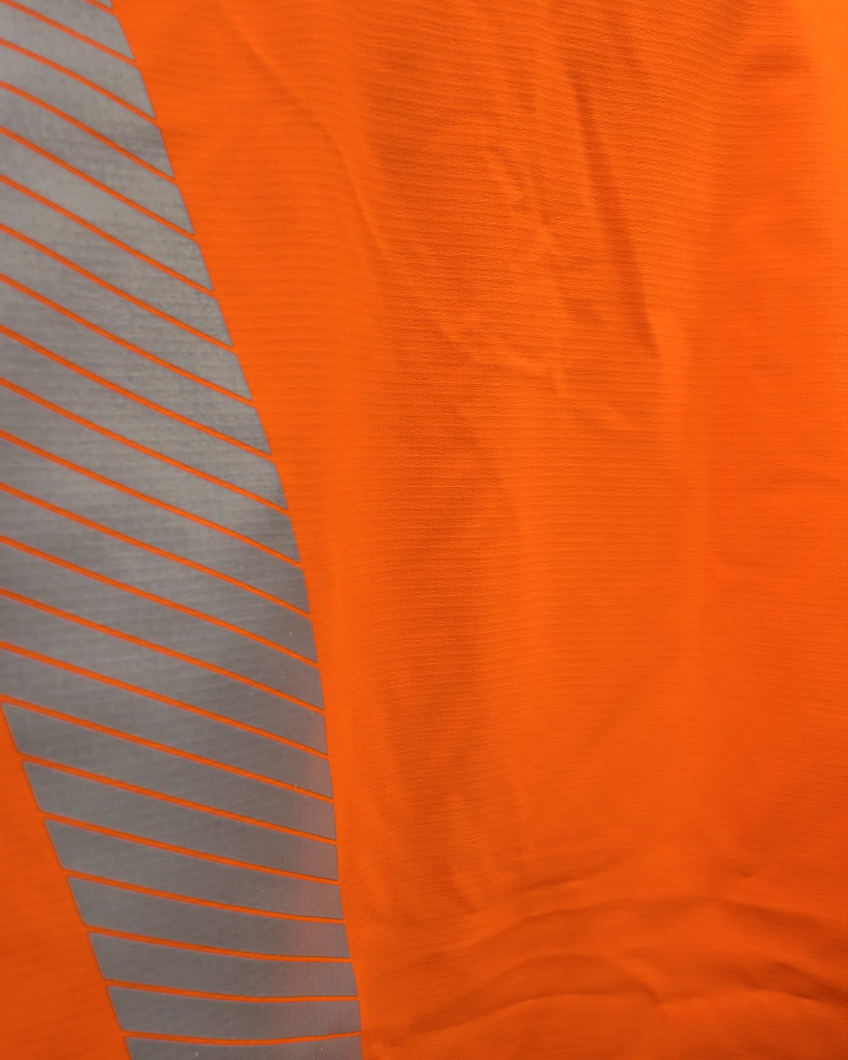 Vohl Hi Vis Waterproof Shell Jacket - Safety Orange - SKU HV-SJ-205, waterproof ripstop fabric close-up with reflective print detail | color:Safety Orange