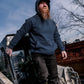 Men’s heavyweight fleece hoody in blue worn on construction site, stepping out of machinery – SKU WW-PO-600 | color:Detroit Blue