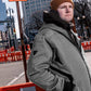 Men’s quilted lined work jacket in Pewter worn on urban construction site – SKU WW-UJ-700 | color:Pewter